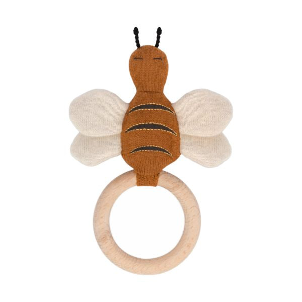 Een rammelaar en bijtring in de vorm van een beige kleurige libelle