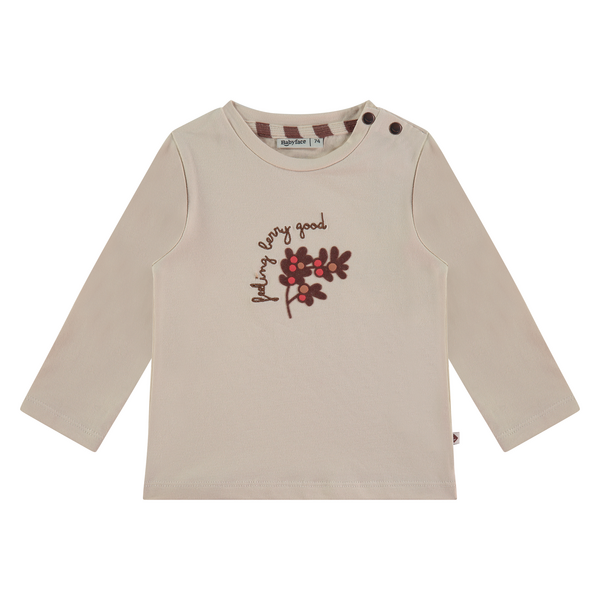Een gebroken witte baby trui met een leuke bruin print