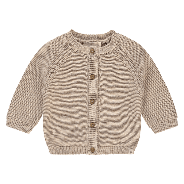 Een beige kleurige babyvestje met knoopjes
