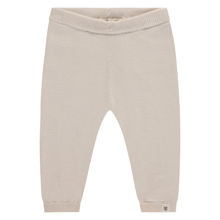 Een beige babybroekje