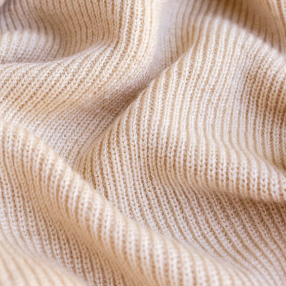 Hvid Babydeken handgemaakt van 100% merinowol. In de kleur oat, rood en otter.