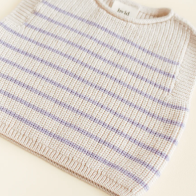 Hvid vest Harvey baby Cream Lila gemaakt van 100% merinowol. Maat 0-6 maanden.