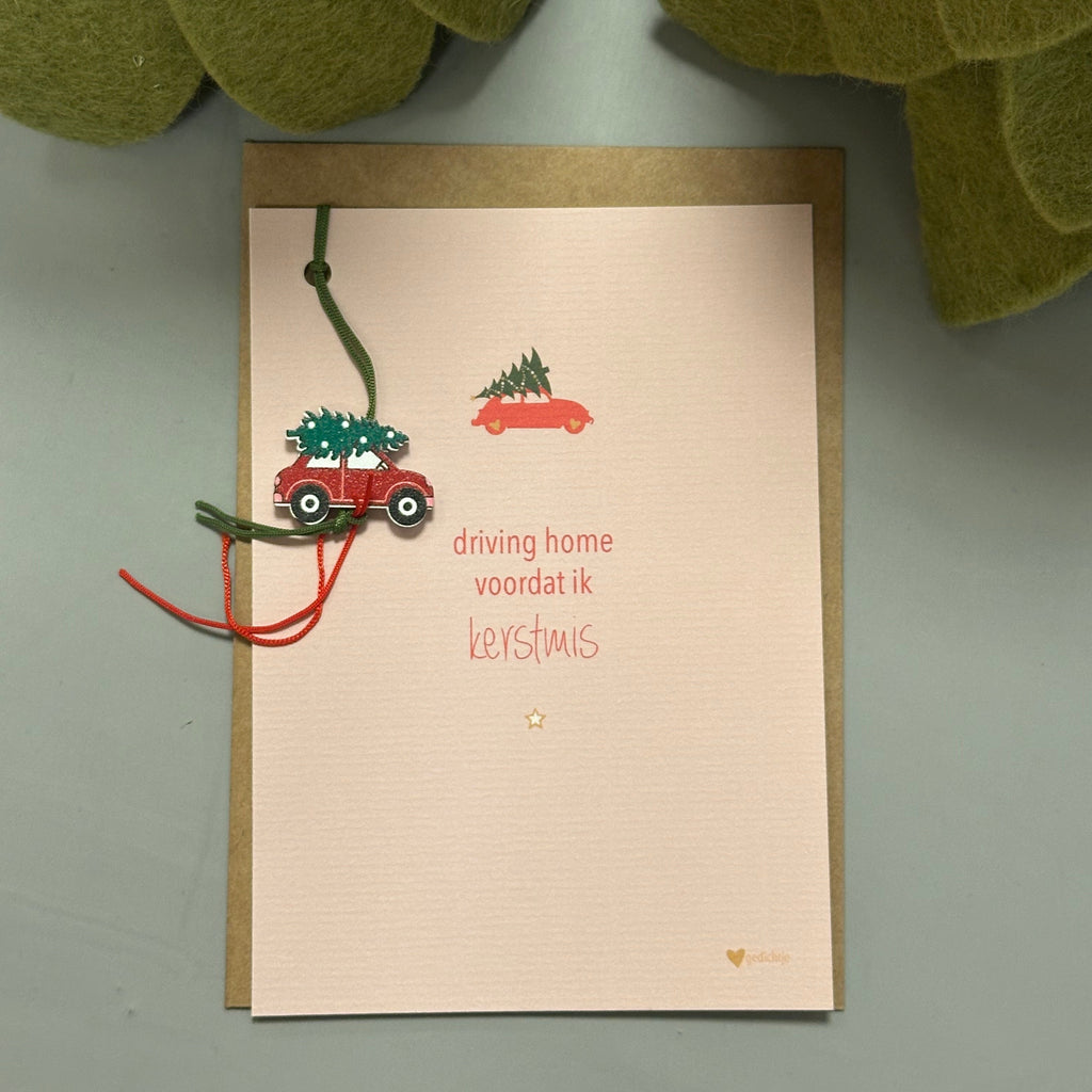 Enkele kerstkaart met envelop. Aan de kaart hangt een leuke kersthanger.