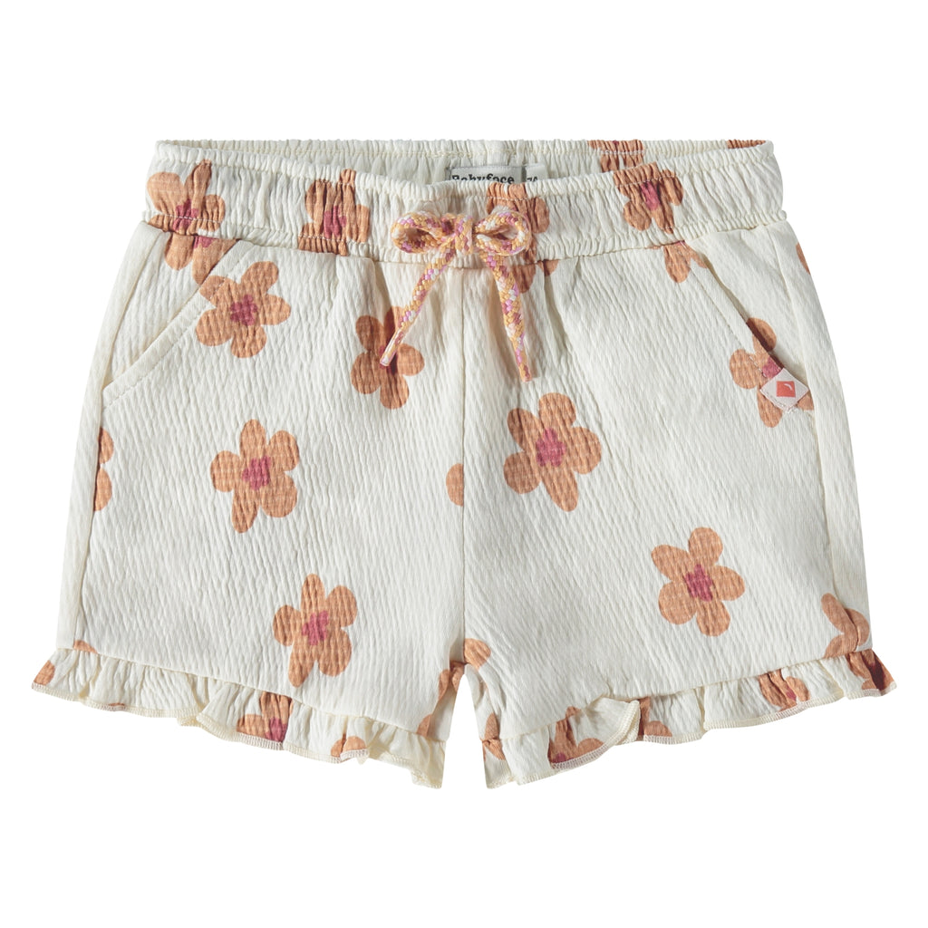 Een witte korte broek met beige bloemetjes