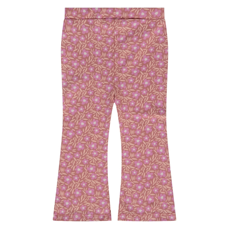 Een roze legging met flaired pijp met bloemetjes