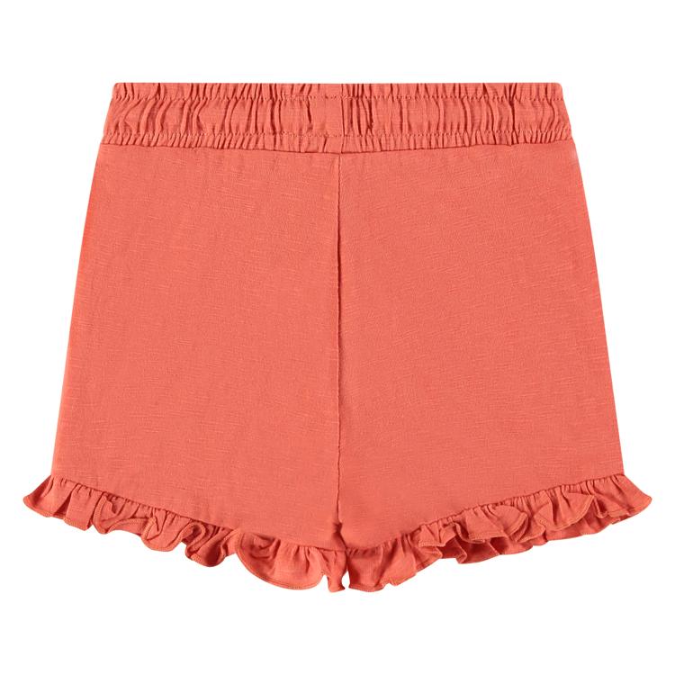 Een oranje kleurige baby korte broek
