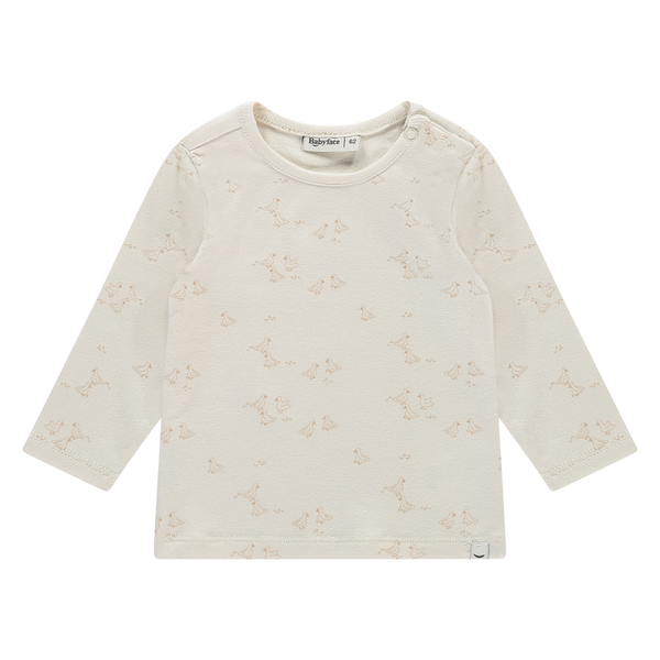 Een ivory kleurige babyshirtje met beige gansjes