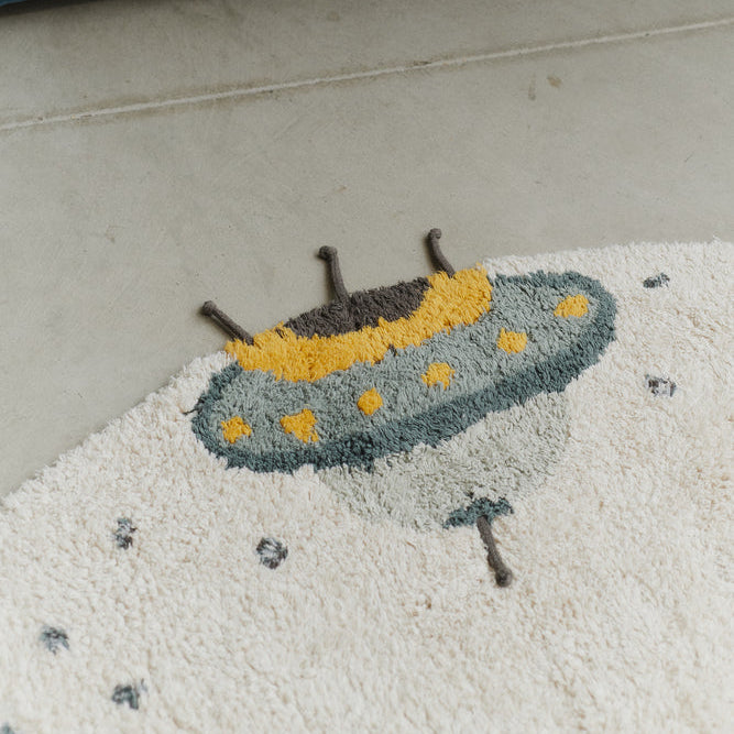 Een spaceshuttle op een vloerkleed