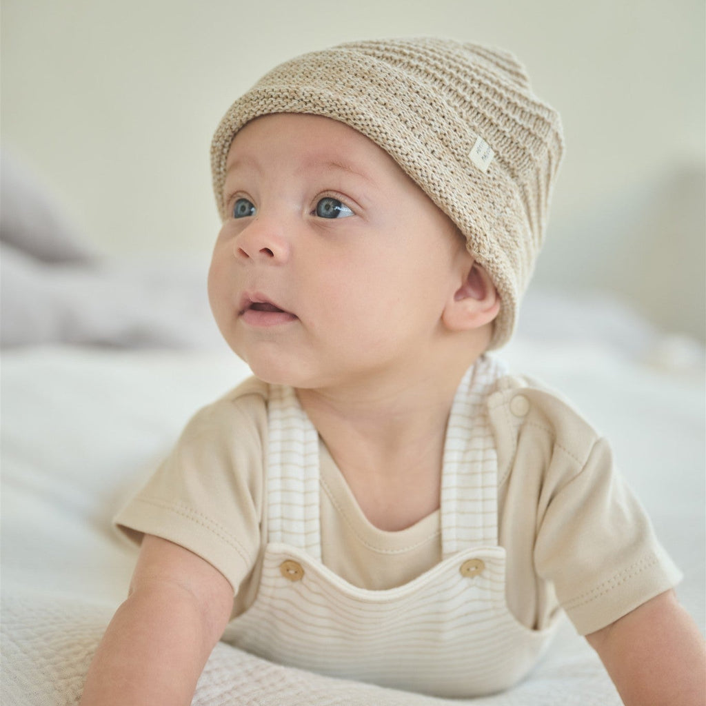 Petite Maison Baby Mutsje van katoen in de kleuren beige, outmeal, offwhite, roze. In maat 56,56,62,68.