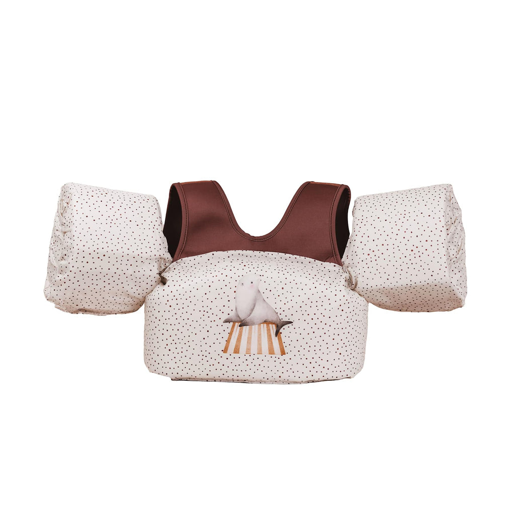 Een witte puddle jumper met stipjes en bruine bandjes
