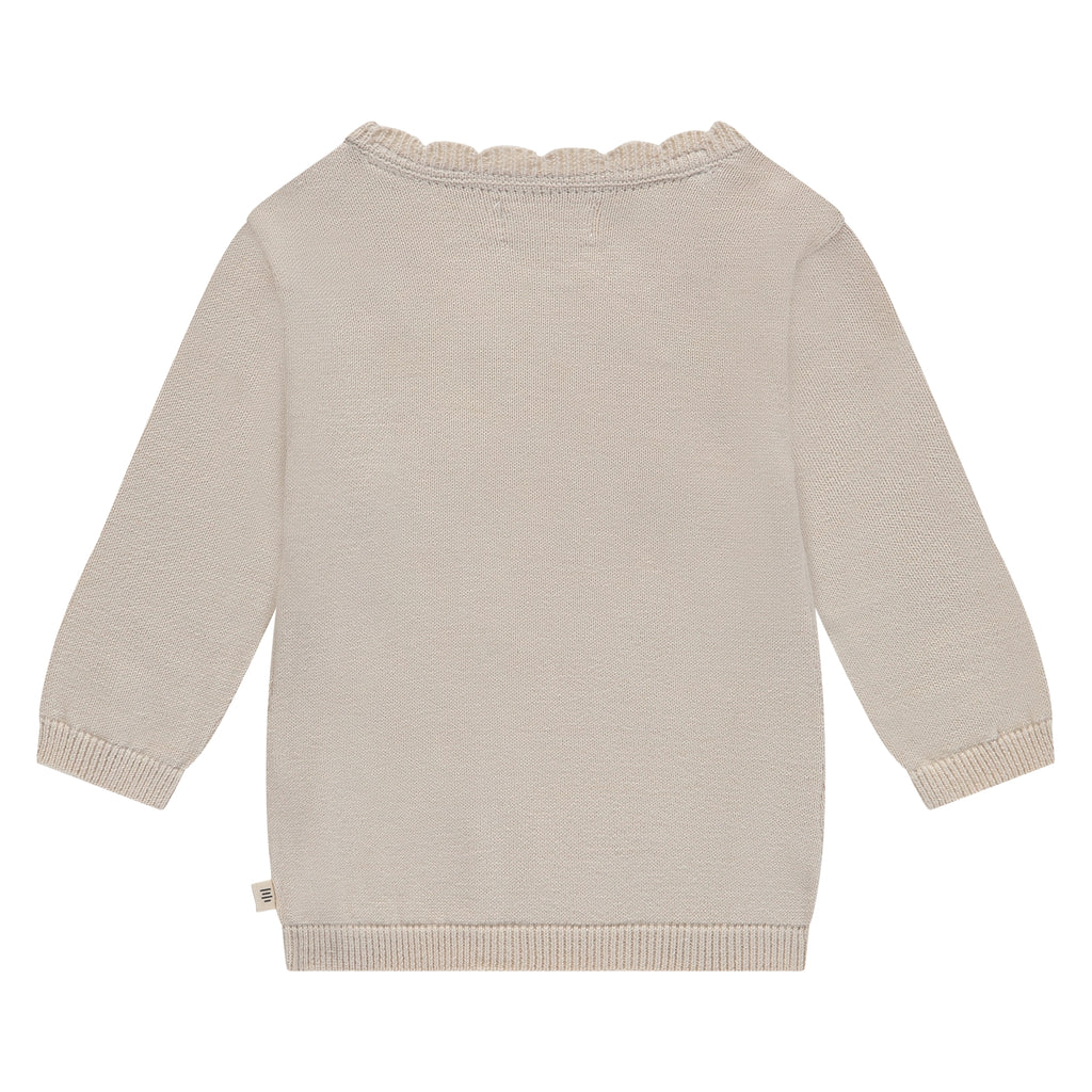 Een beige overslagshirtje