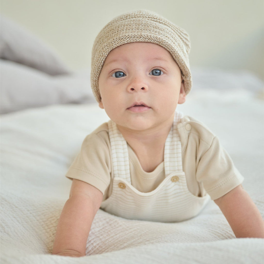 Petite Maison Baby Mutsje van katoen in de kleuren beige, outmeal, offwhite, roze. In maat 56,56,62,68.