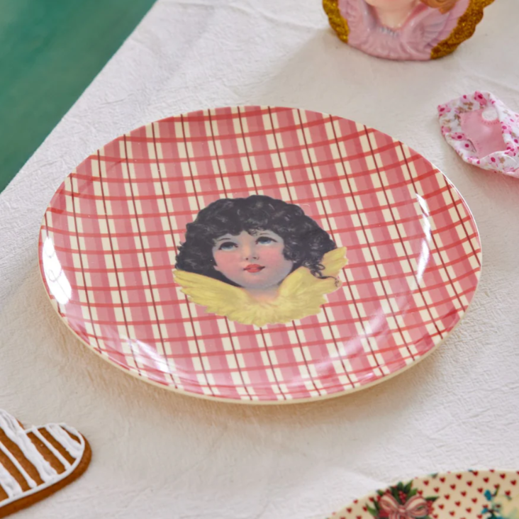 Bordje van melamine in de kleur rood met een kerstthema. 