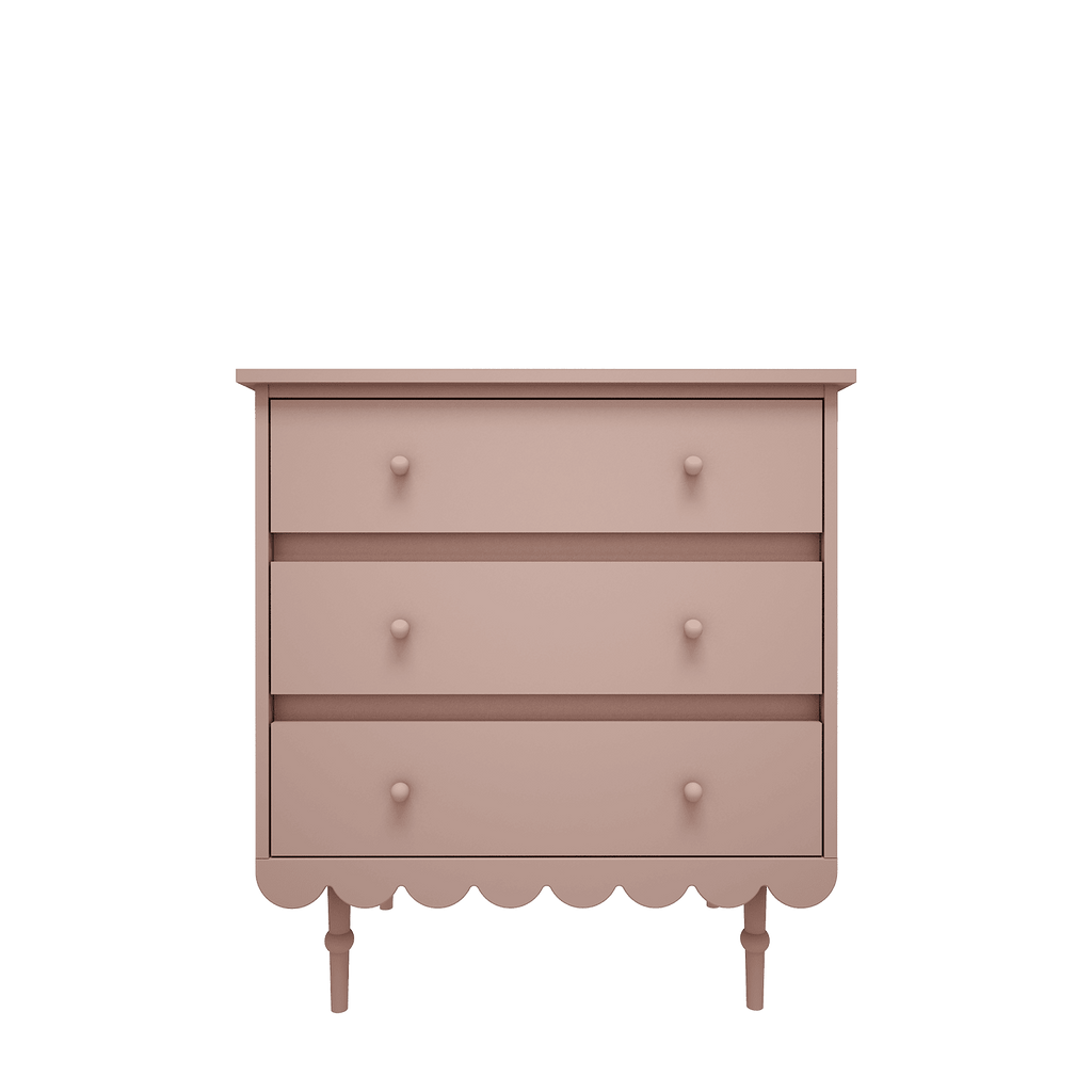 Een roze commode met 3 lades in retrostijl 