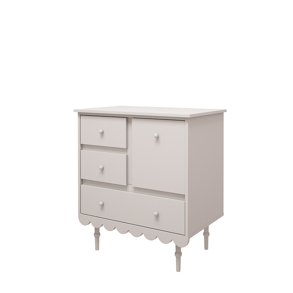 Een witte commode met leggedeelte en lades