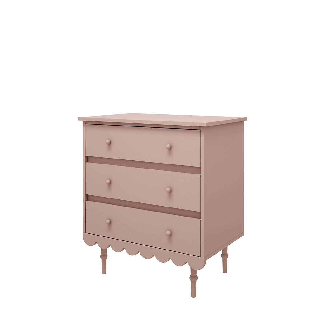 Een roze commode in retro stijl met 3 lades
