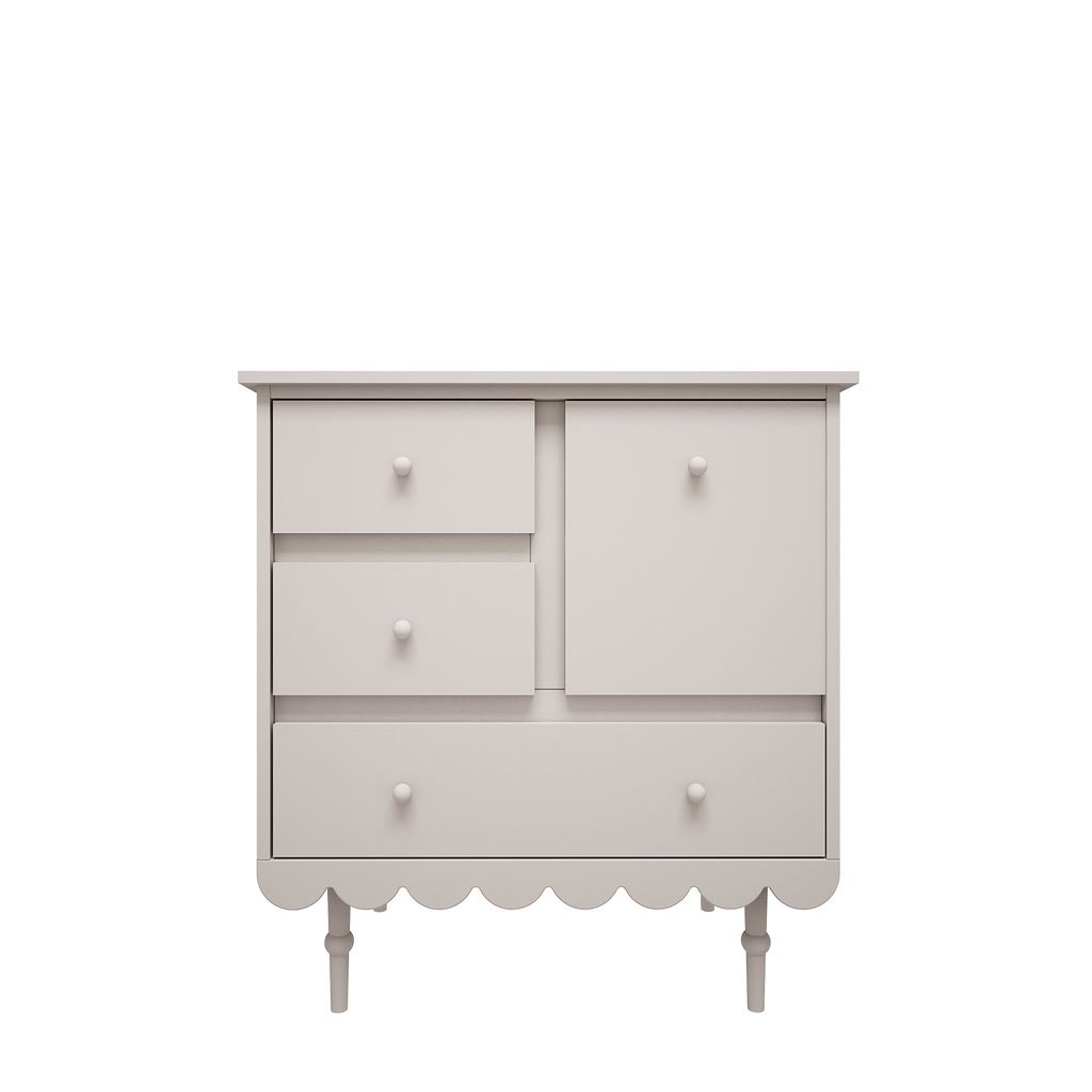 Een witte commode met lades en leg gedeelte